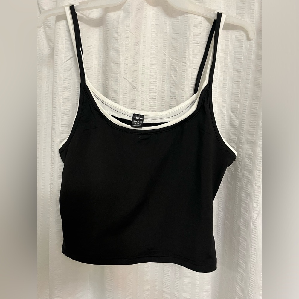 Size medium. Black and white tank top